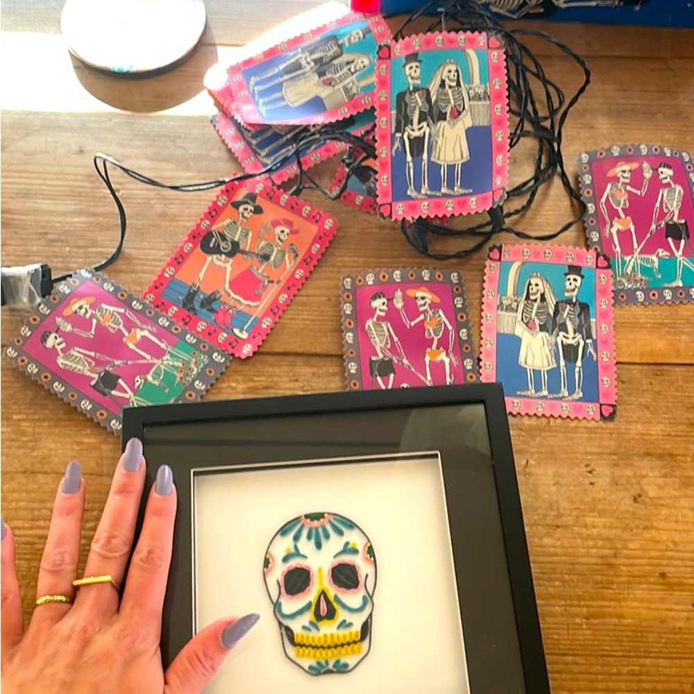 Sketelton string lights and skull framed photo